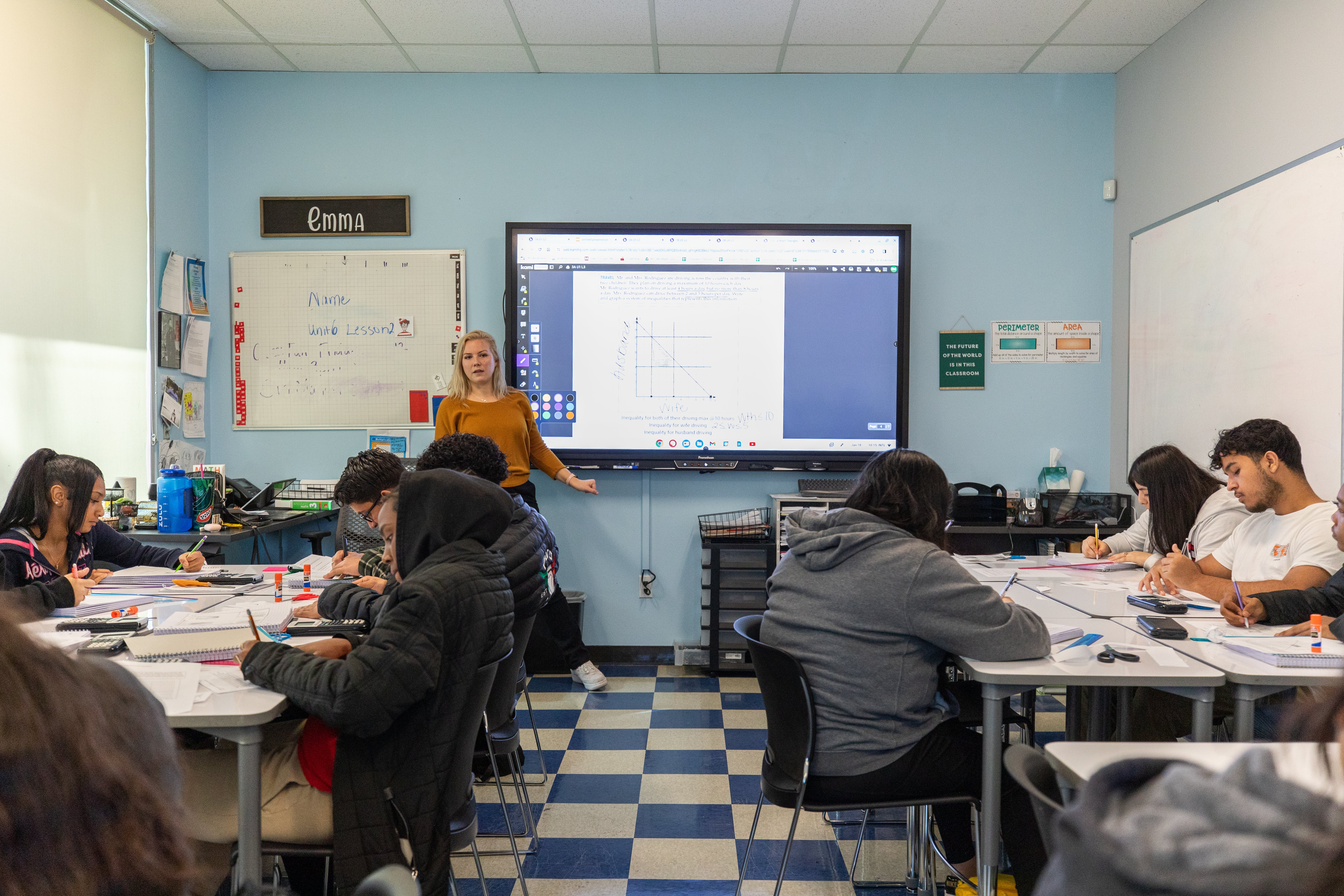A teacher leading a small group of students.
