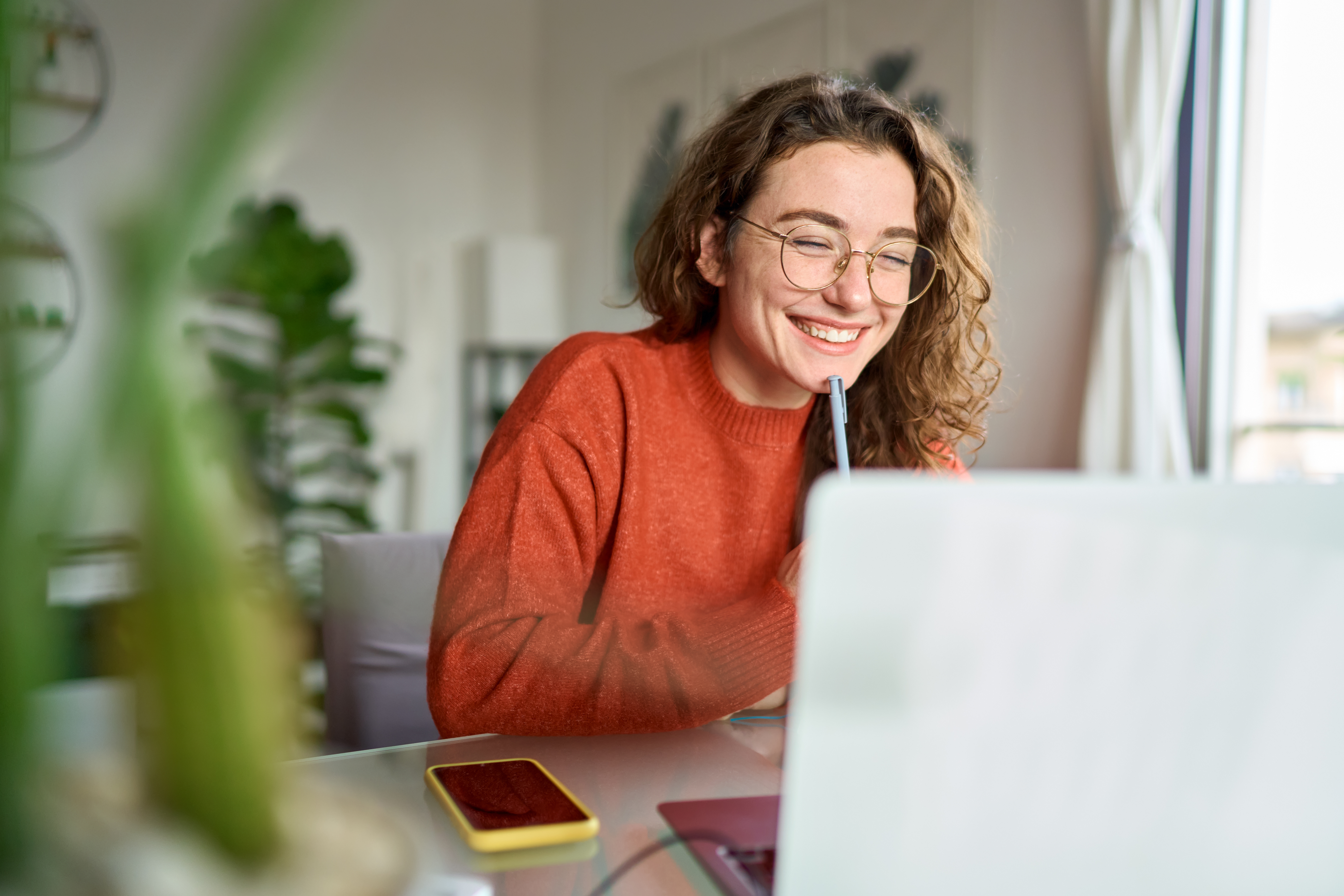 A girl studying online on her laptop.