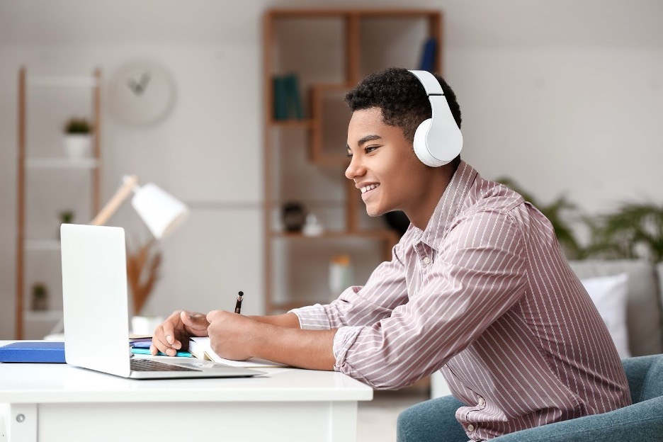 A student learning at a laptop.
