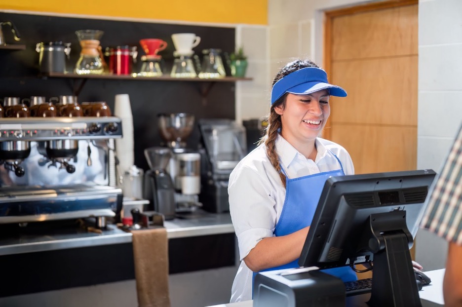 A student working in a restaurant.